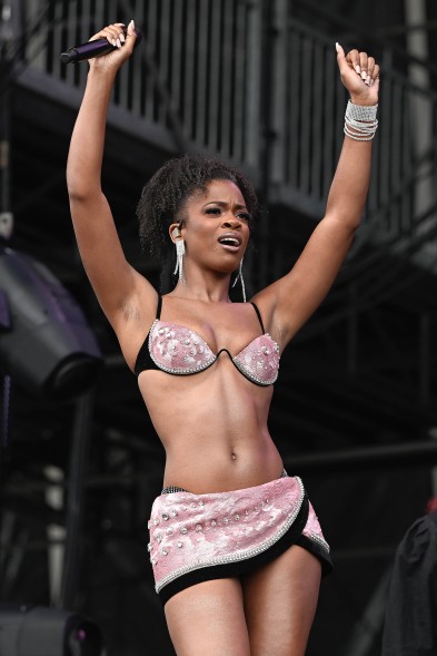 Ari Lennox wears a pink sparkling bra-and-miniskirt set during her performance at Governors Ball 2023.